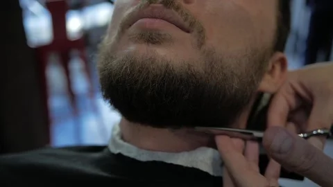 Cuts a beard with scissors Stock Footage 132239086