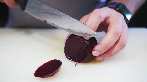 Cuts beets with a kitchen knife Stock Footage 169226326