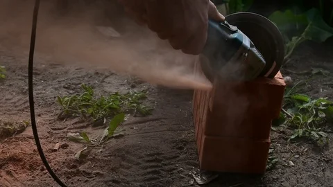 Cuts a brick with a power tool, dust Stock Footage 116885868