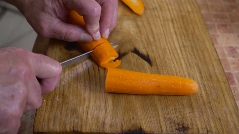 Cuts carrots Stock Footage 80103517