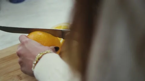 Cuts an orange Stock Footage 133716273