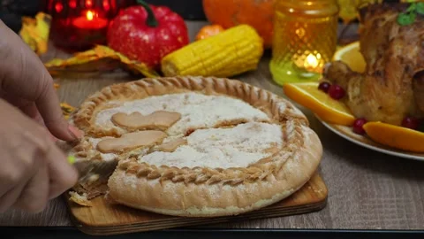 Cuts a pie for festive dinner at home. Thanksgiving  or Christmas dinner. 스톡 동영상 257597570