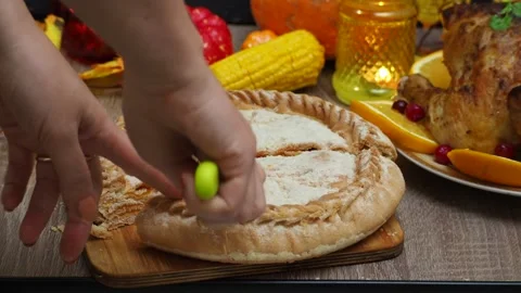 Cuts a pie for festive dinner at home. Thanksgiving  or Christmas dinner. Stock Footage 257597881