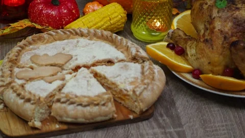 Cuts a pie for festive dinner at home. Thanksgiving  or Christmas dinner. Stock Footage 257598579