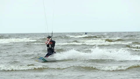 Cuts a wave kite surfer Stock Footage 117356793