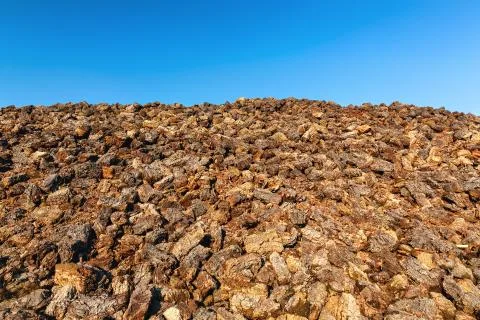 Cutted peat was piled up in a heap after drying Stock Photos