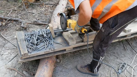 The cutter cuts the iron bars with a disk Stock Footage 104960841