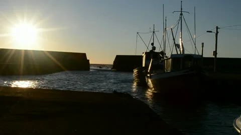 Cutter in the harbor, with back light Stock Footage 14282612