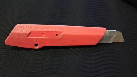 A cutter knife whose blade. Stock Photos