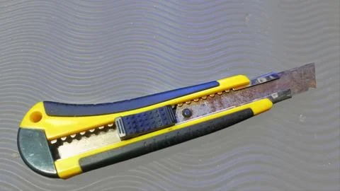 A cutter knife whose blade. Stock Photos