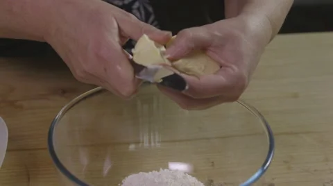 Cutting and adding butter to flour Stock Footage 64016154