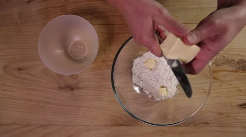 Cutting and adding butter to flour; top-shot Stock Footage 64017562