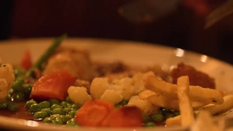 Cutting and Eating Steak Pie Meal in Cozy Restaurant Setting Stock Footage 319003053