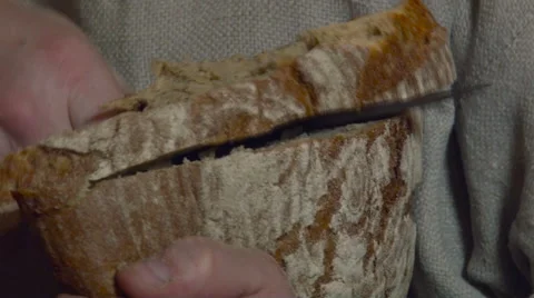 Cutting and Giving Bread. Closeup Stock Footage 65434305