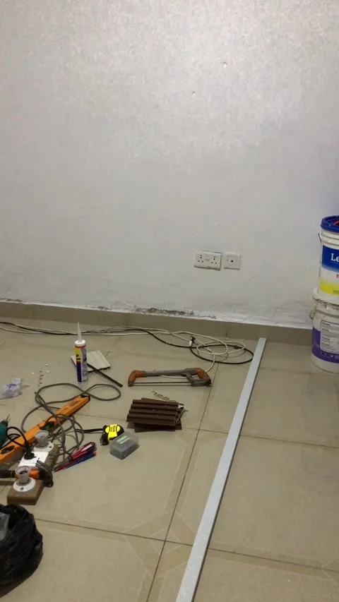 Cutting and Installing of Wall panel /wall paper in Accra, Ghana. March 26,2025 Stock Footage 318072308