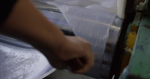 Cutting and Peeling Clear Silicone Rubber Material from Machine Stock Footage 73073397