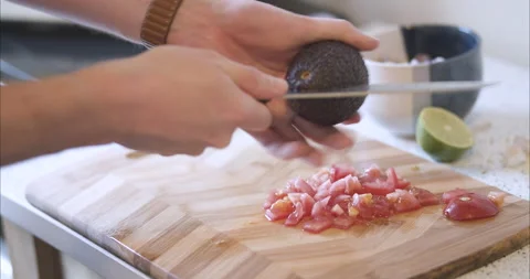 Cutting and pitting an avocado Stock Footage 155547493