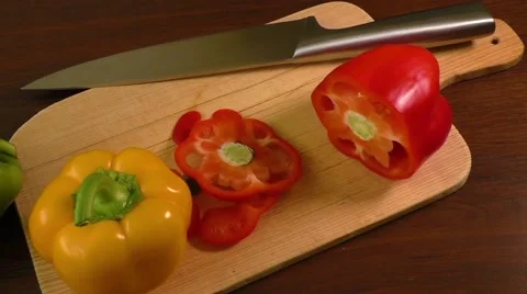 Cutting and preparing bell peppers on a cutting board Video stock 59856246