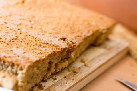 Cutting and preparing cake crust for homemade brownies Stock Photos