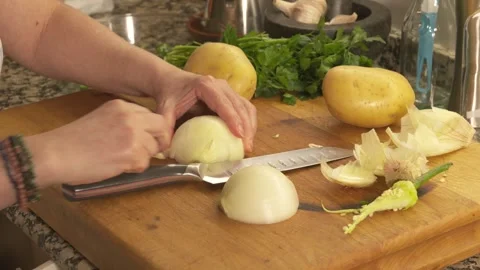 Cutting and preparing fresh vegetables on a wooden board Stock Footage 331313966