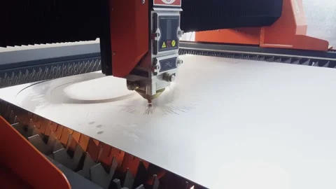 Cutting and processing of metal on a high-precision laser cnc machine Stockbeeldmateriaal 147108859