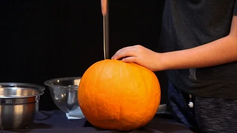 Cutting And Pulling Lid From a Pumpkin Video stock 97598195