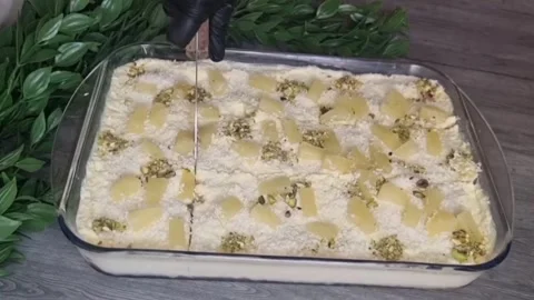 Cutting and Serving No-Bake Pineapple Cake with Pistachios - HD Stock Footage Stock Footage 343877282