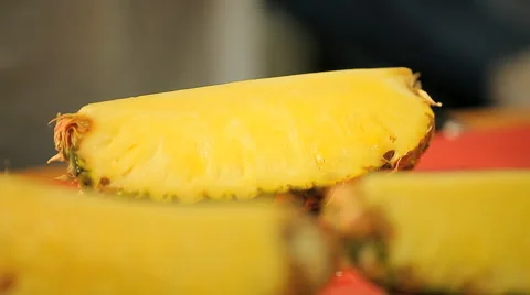 Cutting and serving pineapple in supermarket Stock Footage 62425048