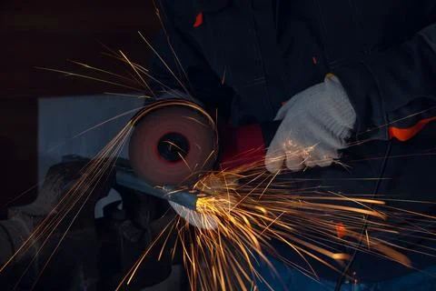 Cutting with an angle grinder Stock Photos