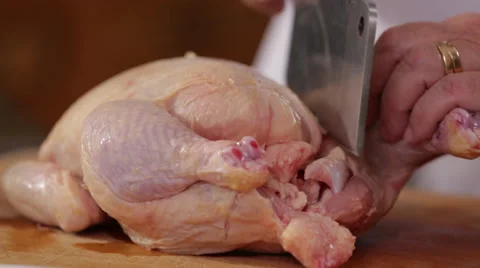 Cutting Apart A Raw Chicken Stockbeeldmateriaal 27297056
