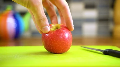 Cutting Apple into 4 Stock Footage 92859048