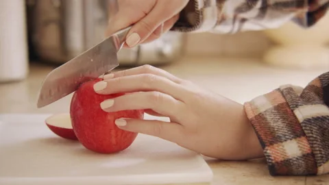 Cutting an Apple 60fps Stock Footage 188028604