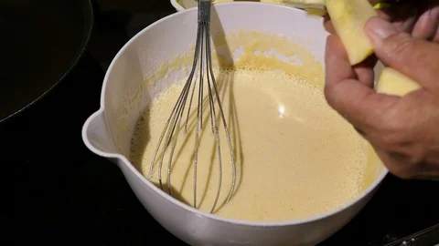Cutting apple fruit in pices as ingredient of pancake dough in a bowl Vídeo Stock 109865455