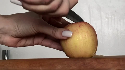Cutting an apple with a knife Stock Footage 221755892