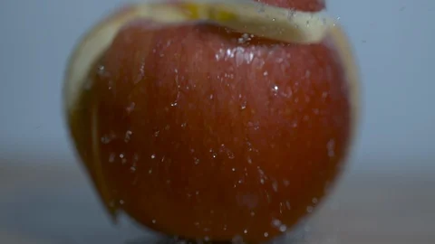 Cutting apple with knife in slow motion Stock Footage 100005346
