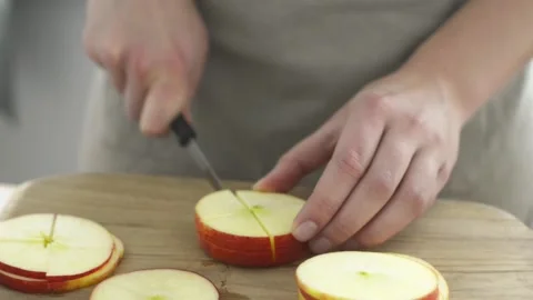 Cutting apple into pieces Stock Footage 140268602