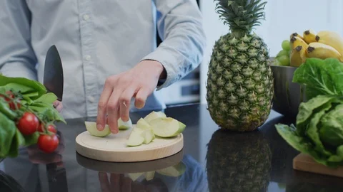 Cutting an apple into small pieces Stock Footage 99941611