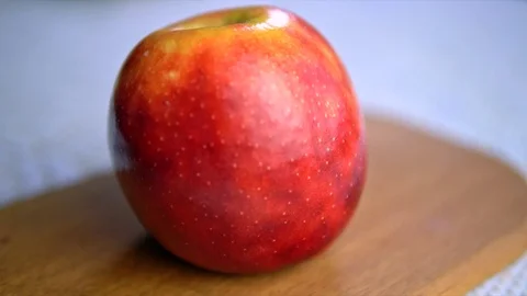 Cutting an apple with a white ceramic knife Stock Footage 75567927