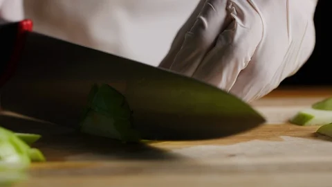 Cutting apples with chef knife macro shot Stock-Footage 128490368