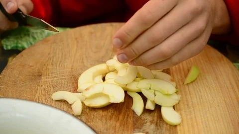 Cutting apples to slices with a knife Stock Footage 71121769