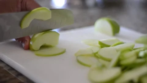Cutting Apples into Wedges  Stock Footage 130356643