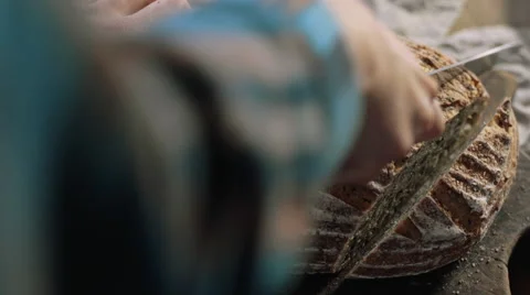 Cutting artisan sourdough bread Stock Footage 59855949