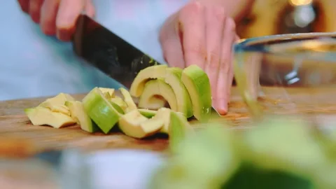 Cutting avocado on a cutting board Stock-Footage 252250784