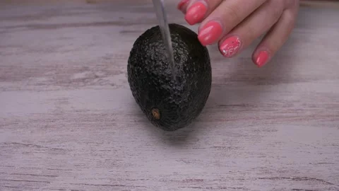 Cutting avocado fruit with knife slow motion 4k Stock Footage 150604098