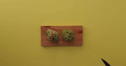 Cutting the avocado in half 1 Stock Footage 132136365