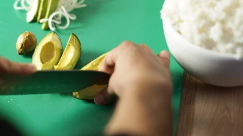 Cutting avocado for sushi Stock Footage 85946925