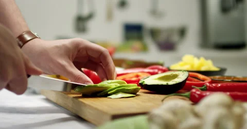 Cutting a avocado in thin slices Stock Footage 61535533