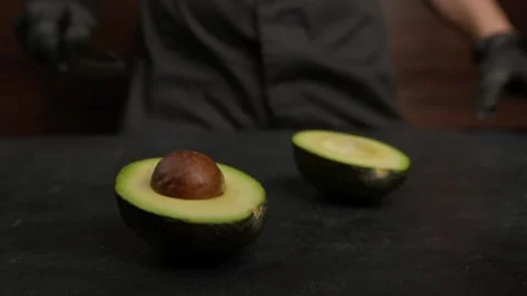 Cutting avokado in half Stock Footage