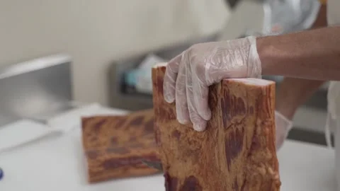 Cutting a bacon slab Stock Footage 219228220