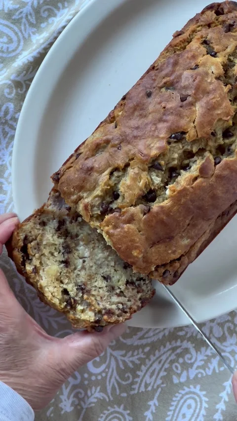 Cutting banana bread with chocolate chips Stock Footage 219508251